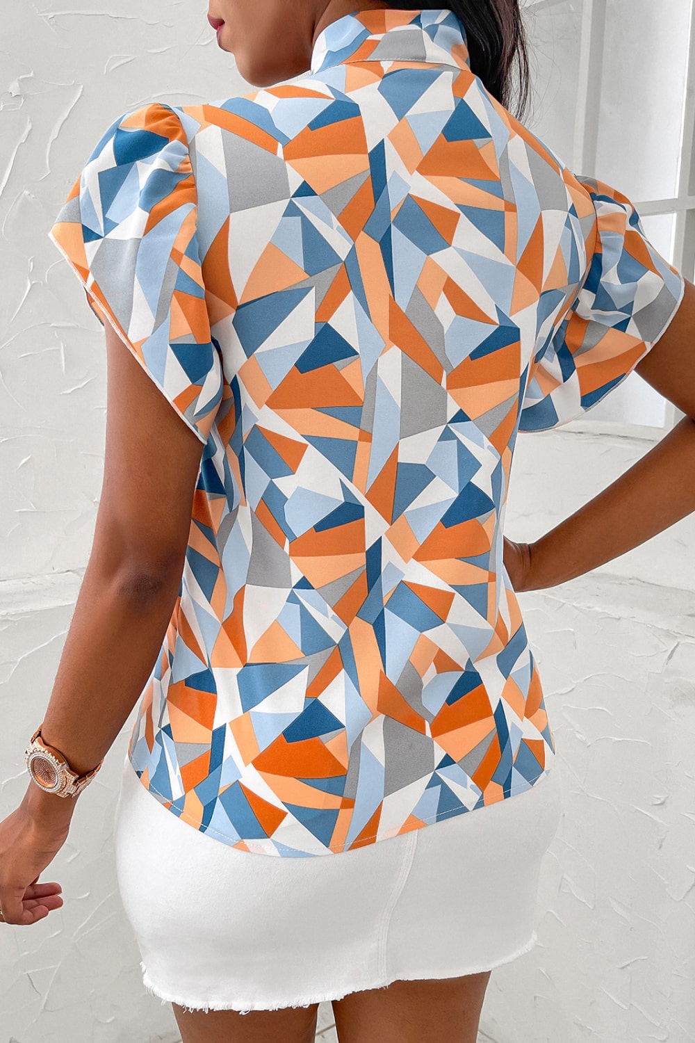 geometric tie neck flutter sleeve blouse