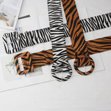 tiger print wide buckled belt
