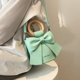 bow tie round wooden handle pu leather crossbody side bag